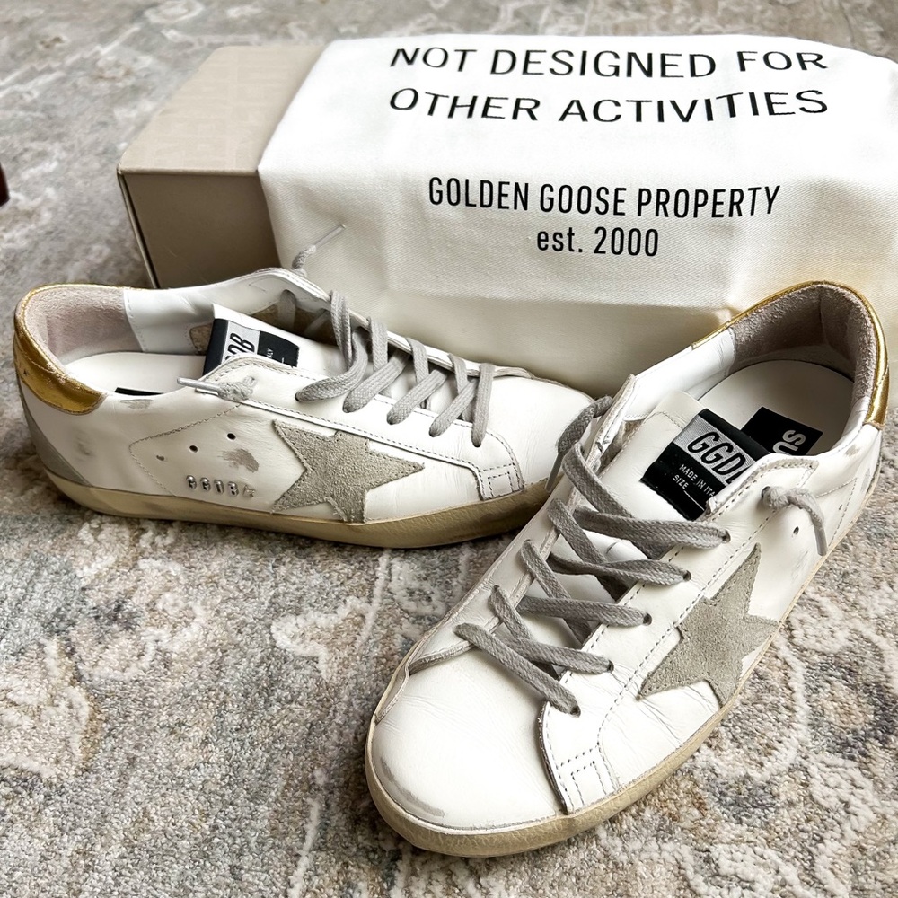 GOLDEN GOOSE
Superstar distressed leather and suede sneakers